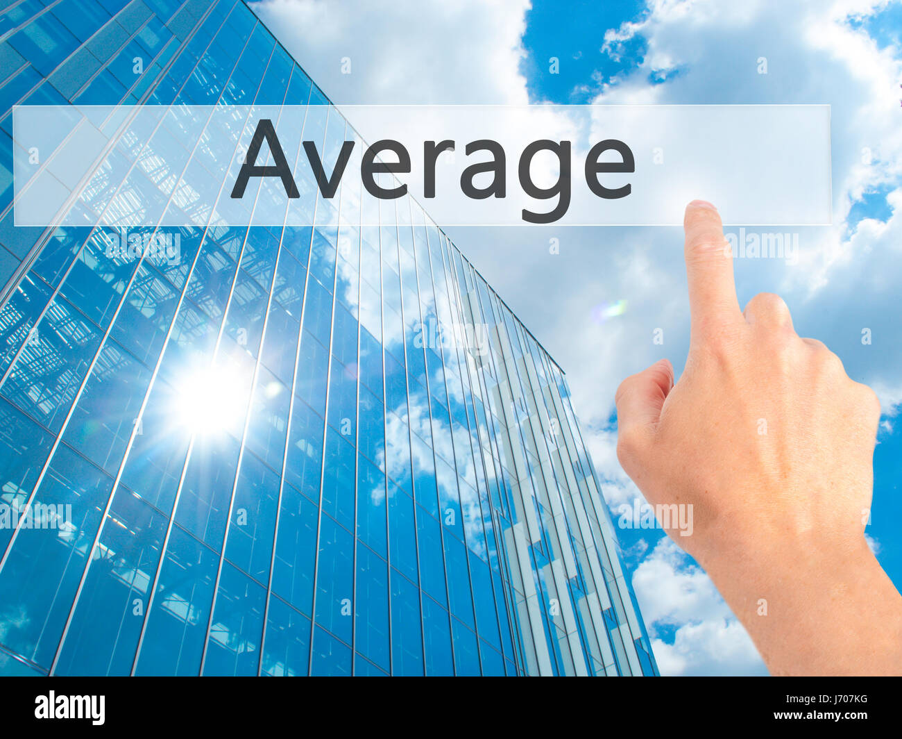 Average - Hand pressing a button on blurred background concept ...