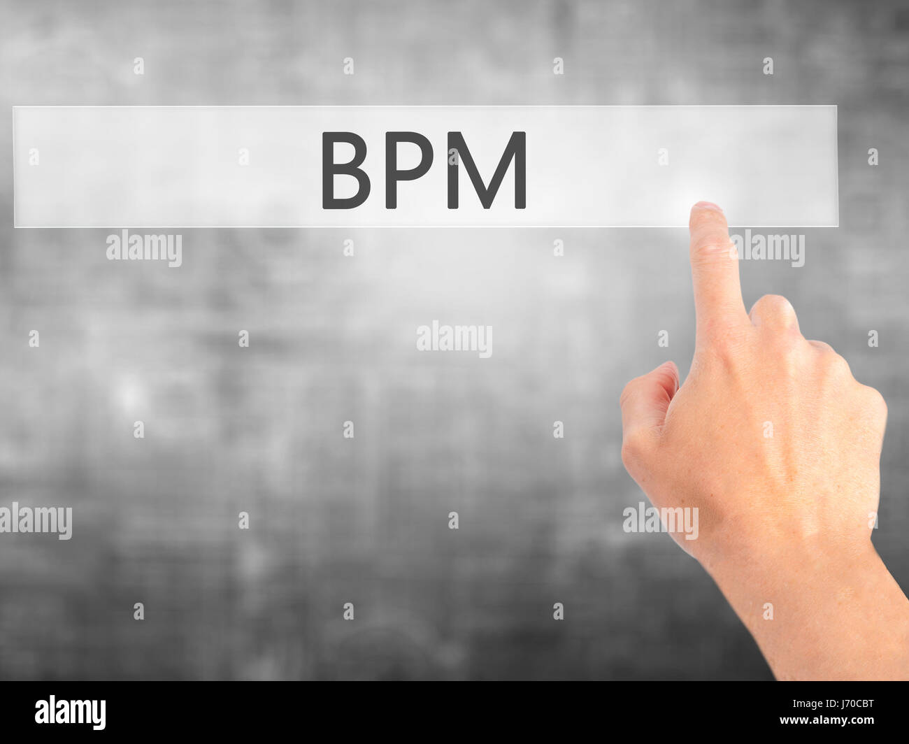 BPM (Business Process Management) - Hand pressing a button on blurred ...