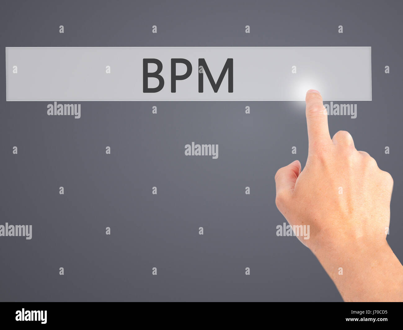BPM (Business Process Management) - Hand pressing a button on blurred ...