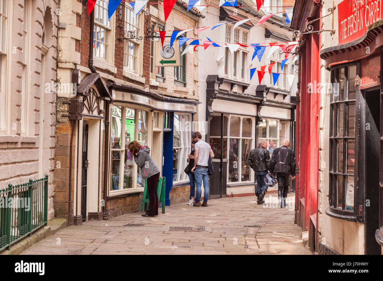 Shoppers and visitors in Grape Lane, Whitby, North Yorkshire, England. Stock Photo