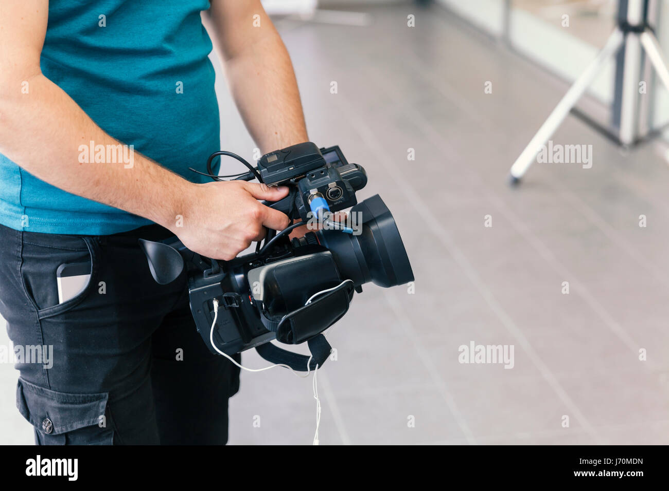 cameraman shooting with handheld camera Stock Photo