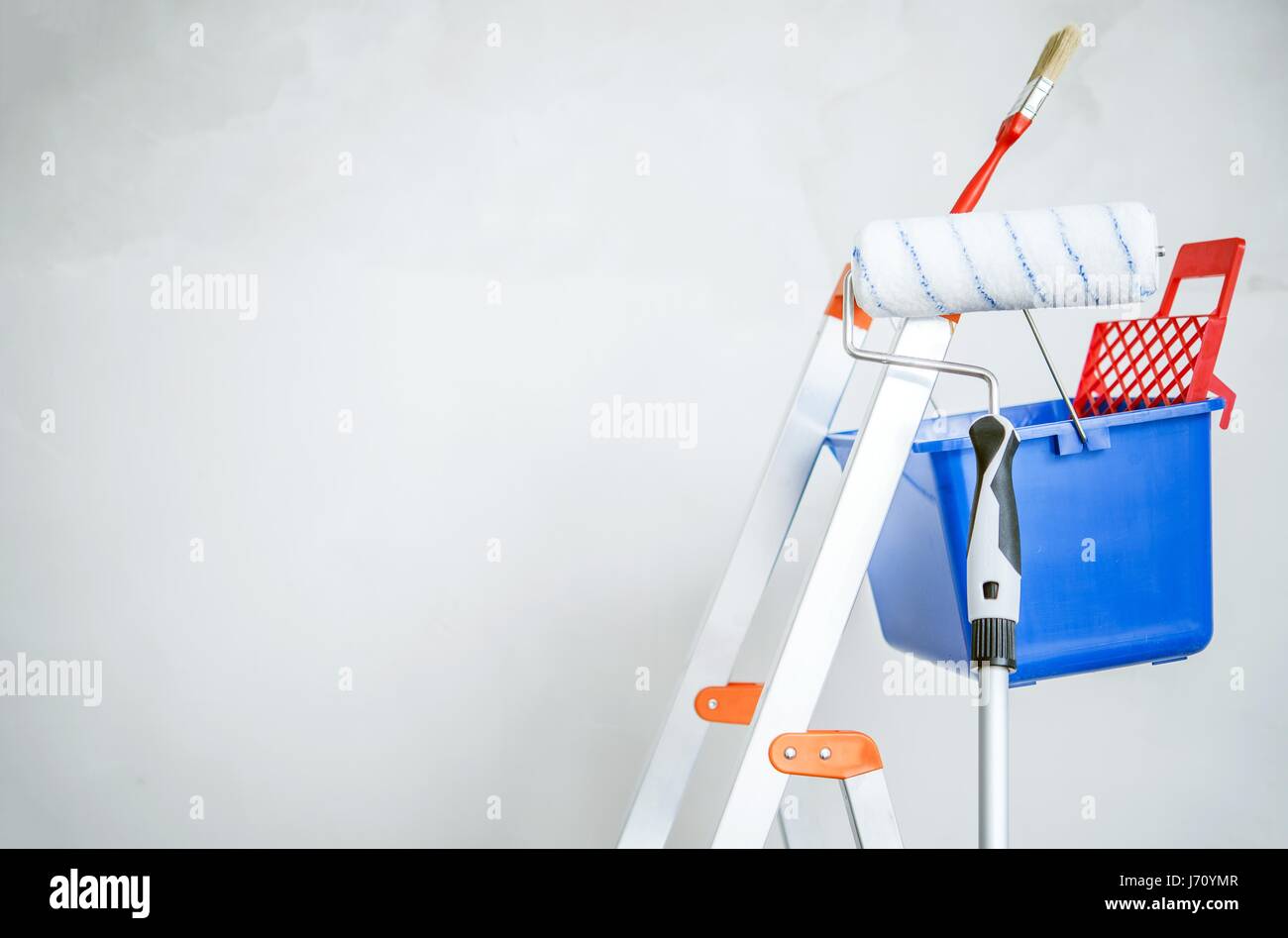 Room Painting Equipment. Ladder, Painting Brush and Roller Stock Photo
