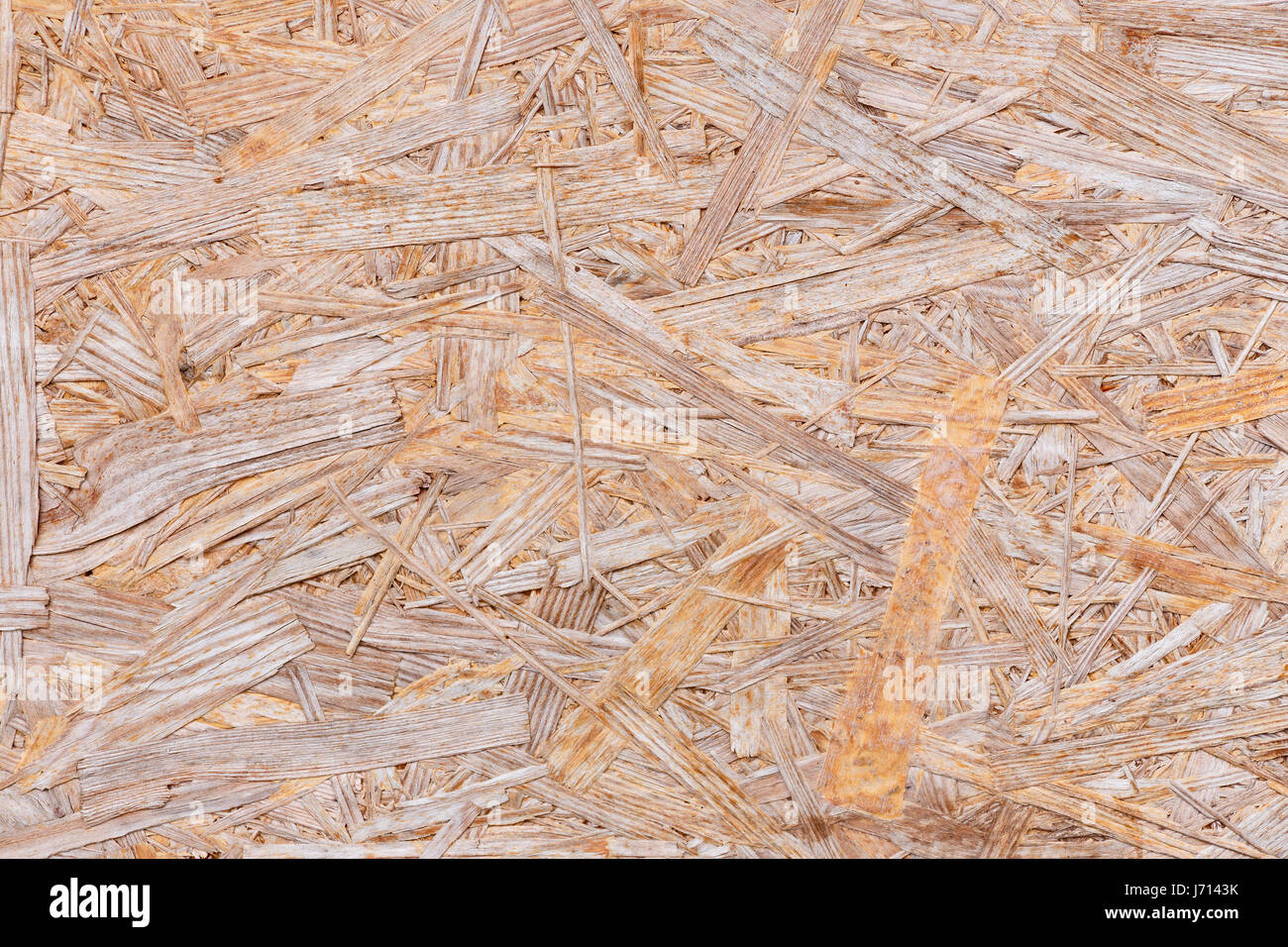 Background of pressed sawdust. Macro shot of wood particle board Stock Photo