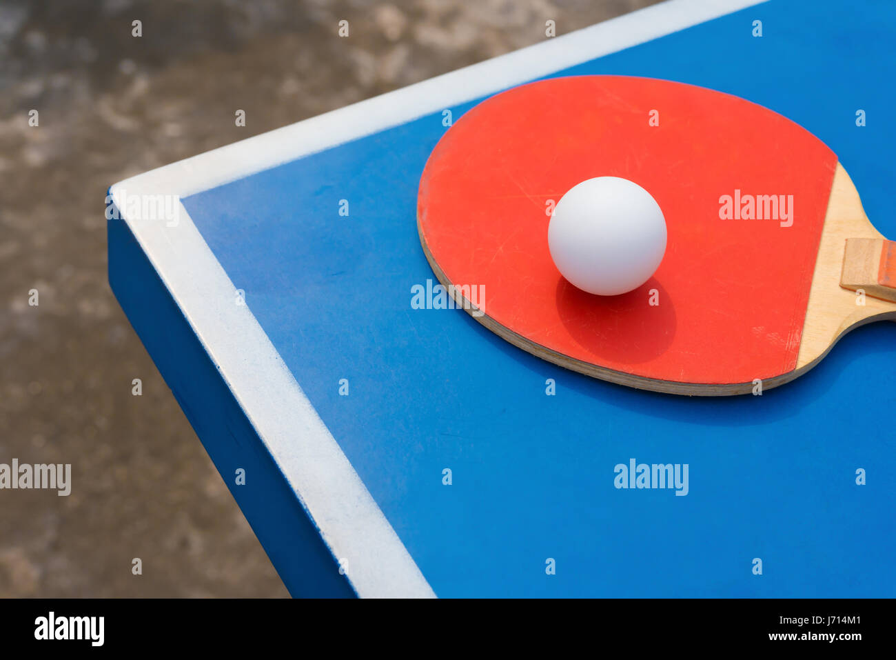 pingpong rackets and ball on a blue table Stock Photo