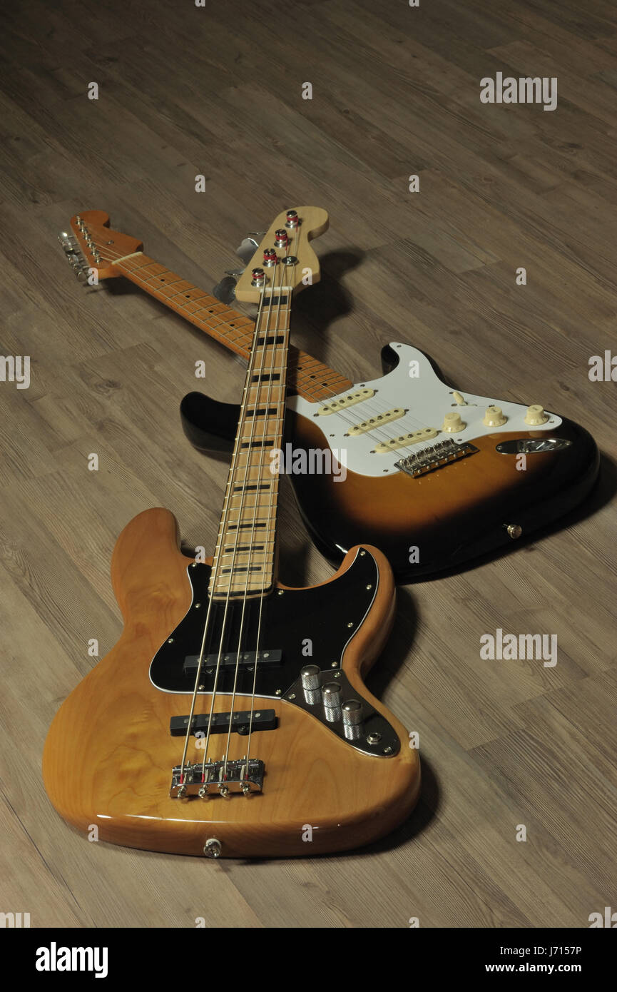 musical instruments guitar stringed instruments bass basso music wood four Stock Photo