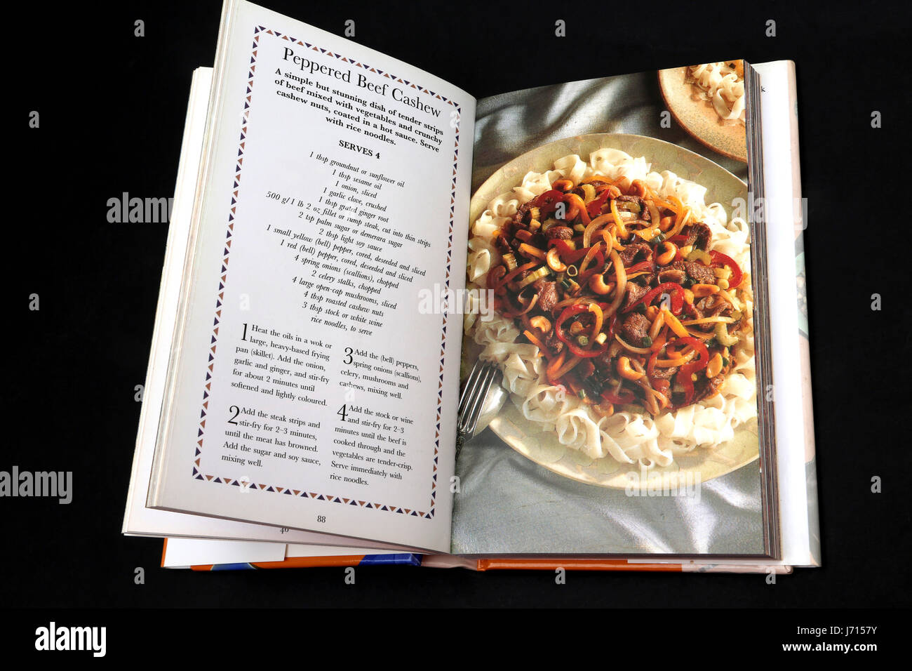 Hot and Spicy Recipes cookery book peppered beef cashew with noodles Stock Photo