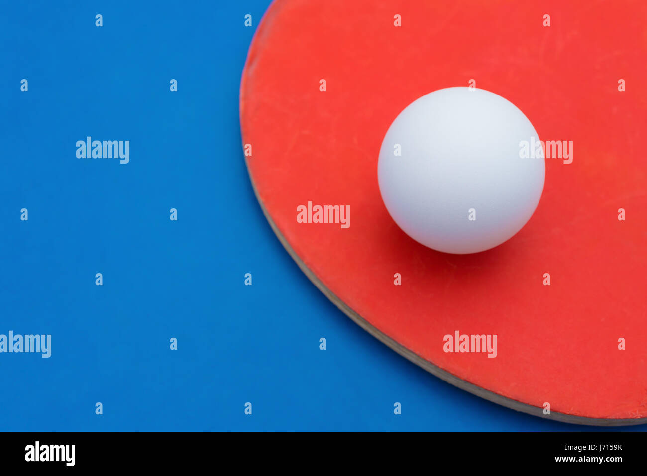 pingpong rackets and ball on a blue table cloes up Stock Photo