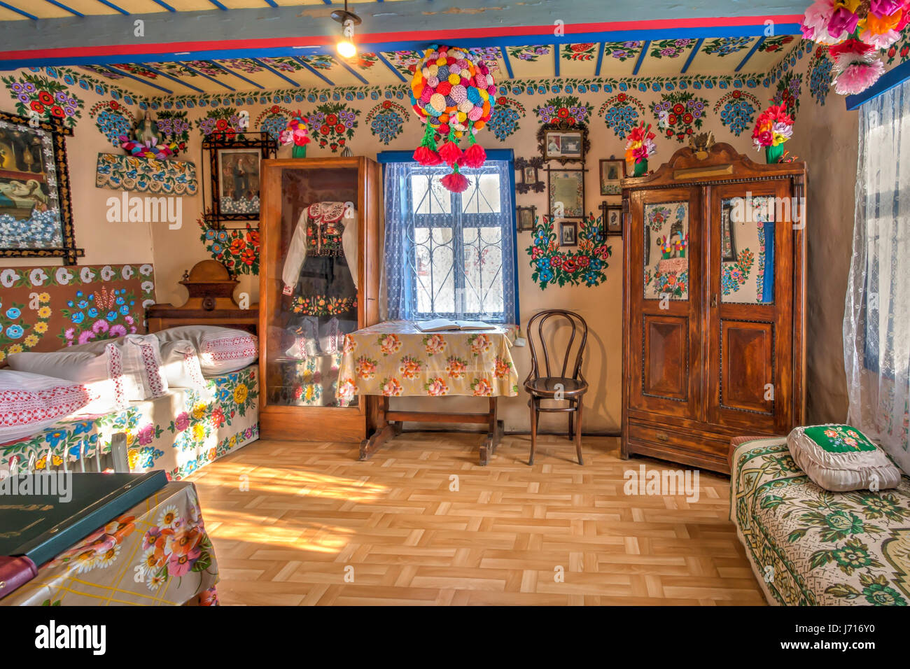 Zalipie, Poland - January  07, 2017: Colourful room in the log house  of Felicia Curylowa in the village Zalipie in Malopolska Stock Photo
