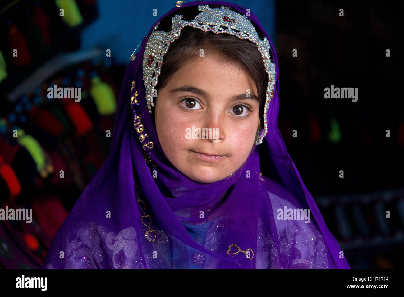 Bakhtiari girl wearing traditional costume in Chelgerd, Iran Stock Photo