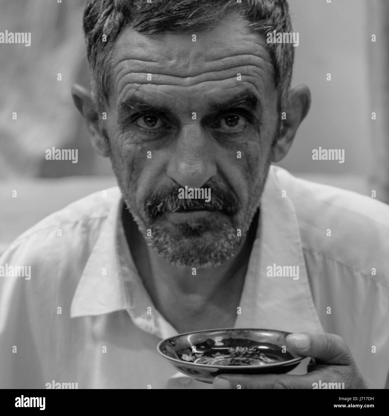 Old man having a tea in Kashan Bazaar, Iran Stock Photo