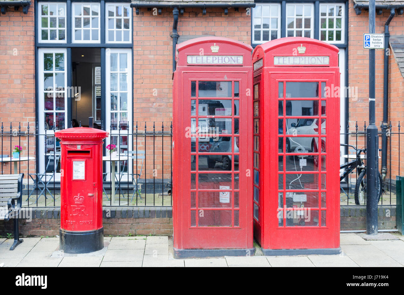 Two red telephone boxes and a red pillar box in Stratford-upon-Avon, Warwickshire Stock Photo