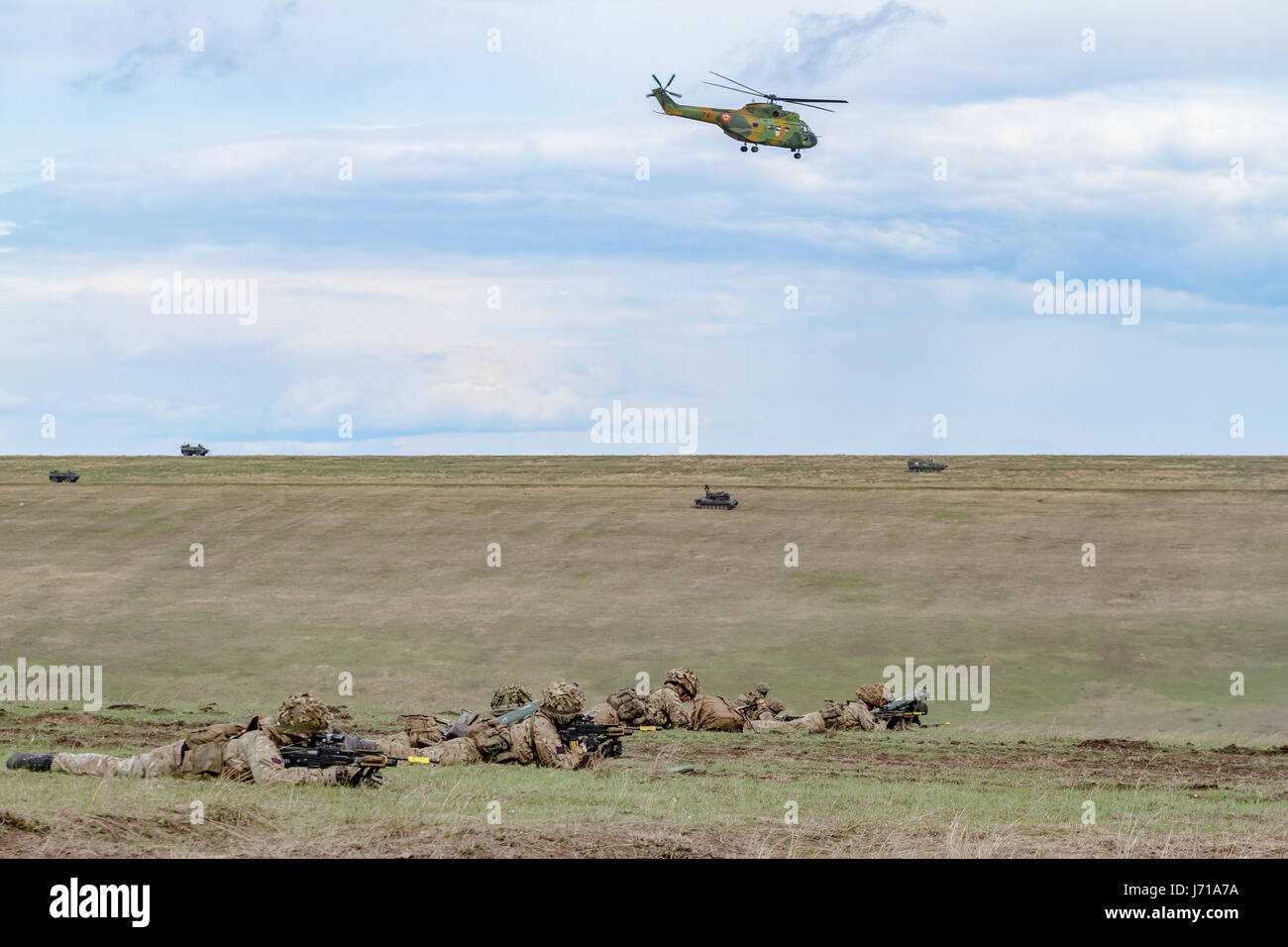 British soldiers run for a new position while being defended by a British soldiers run for a new position while being defended by a