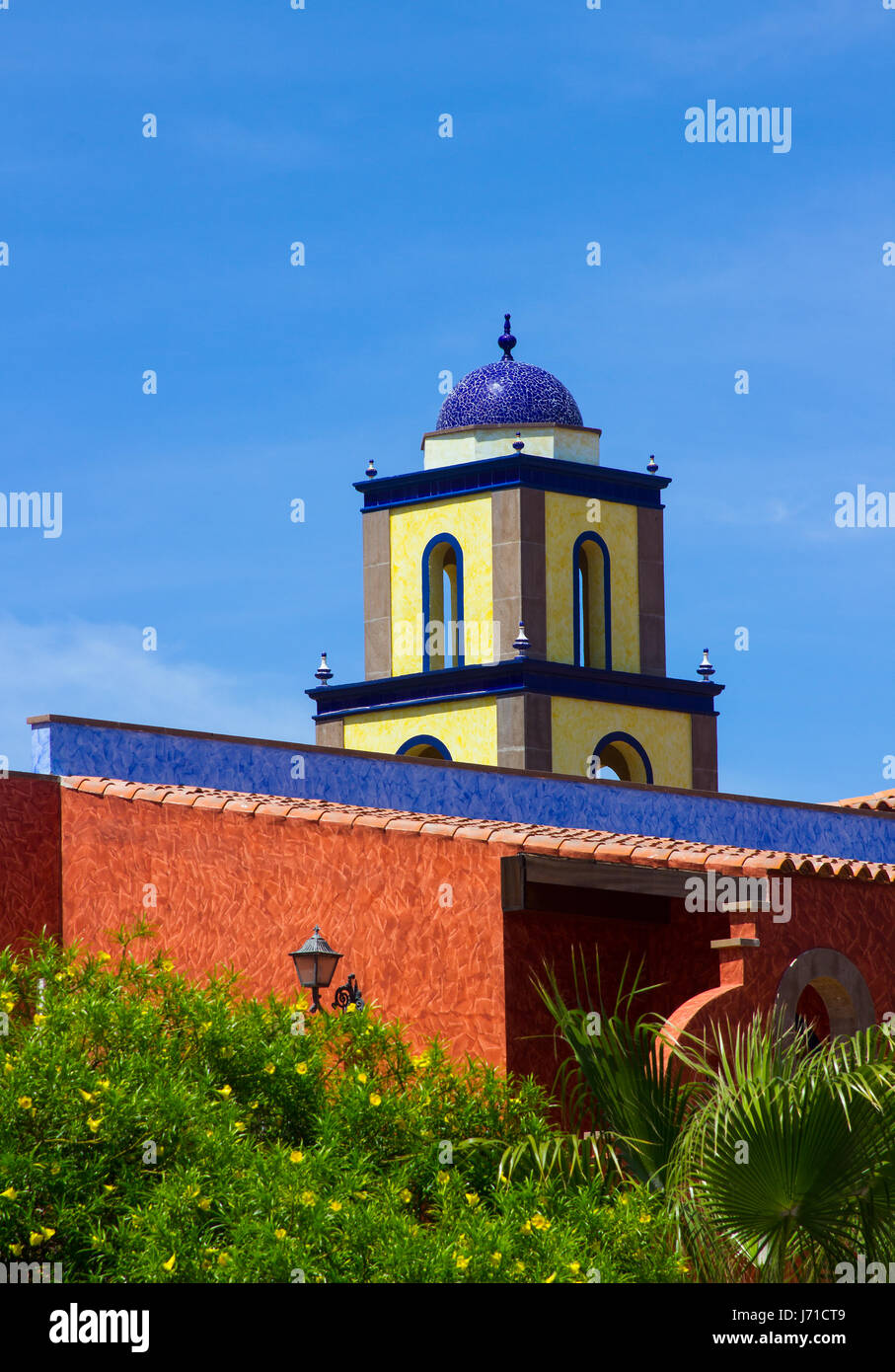 Colorful architectural rooftops in Playa Las Americas in Teneriffe featuring tiled mosaic domes and terracotta tiles in retro Moorish style and design Stock Photo