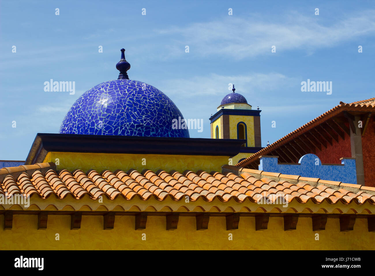 Architectural rooftops in Playa Las Americas in Teneriffe featuring tiled mosaic domes and terracotta tiles in retro Moorish style and design Stock Photo