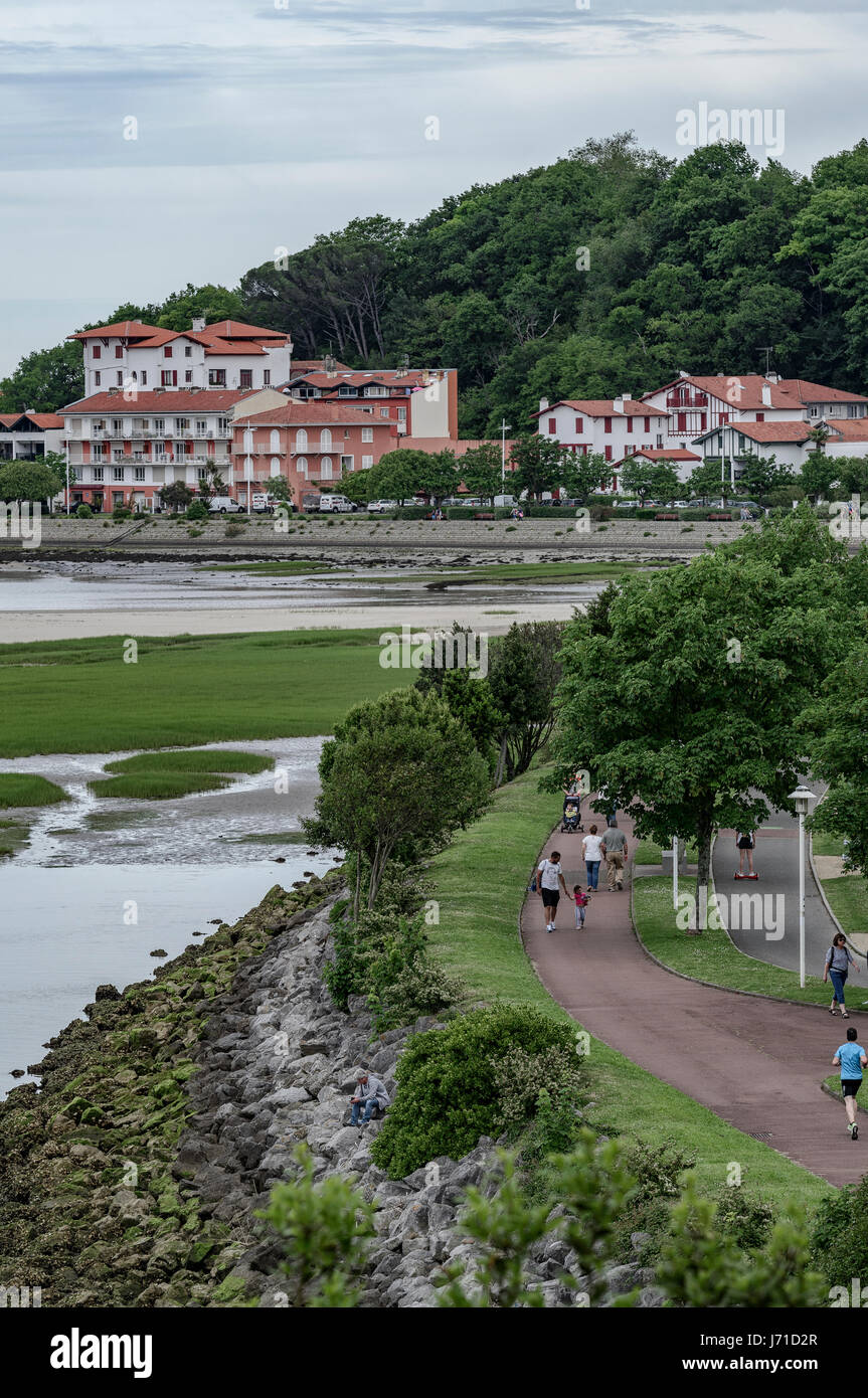 Promenade on the shore of the estuary of the Bidasoa river in Hendaye, France, Europe Stock Photo
