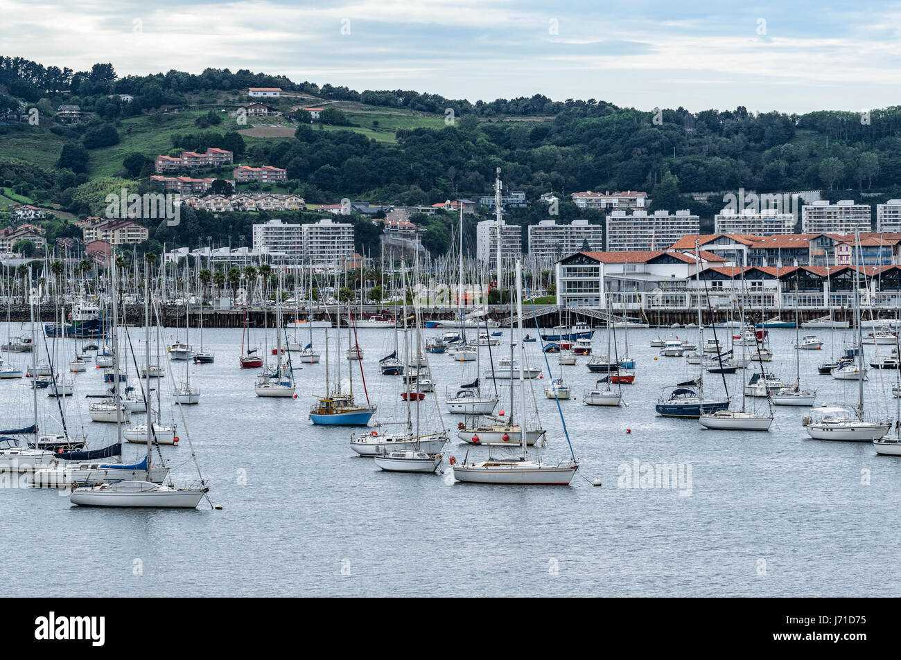 Day cloudy at Bay of Txingudi. Hondarribia, Basque Country, España, viewed from the city of Hendaye, France, in the estuary of the river Bidasoa, Euro Stock Photo