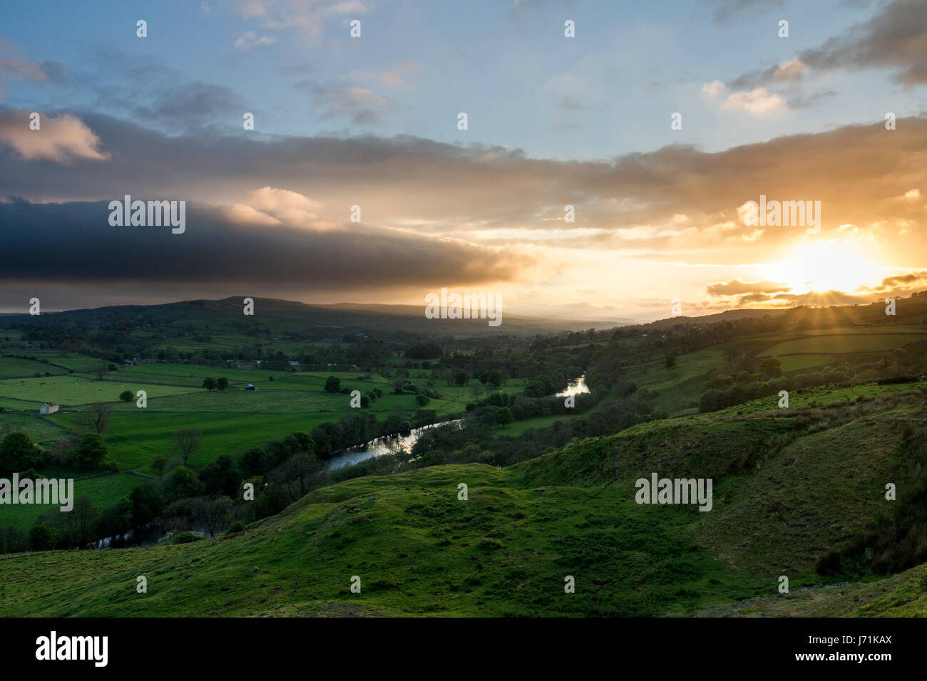 Whistle Crag, Middleton-in-Teesdale, County Durham. Monday 22nd May 2017.  UK Weather.  Golden light illuminates the River Tees in Upper Teesdale as the sun begins to set over the North Pennines in Northeast England.  © David Forster/Alamy Live News. Stock Photo