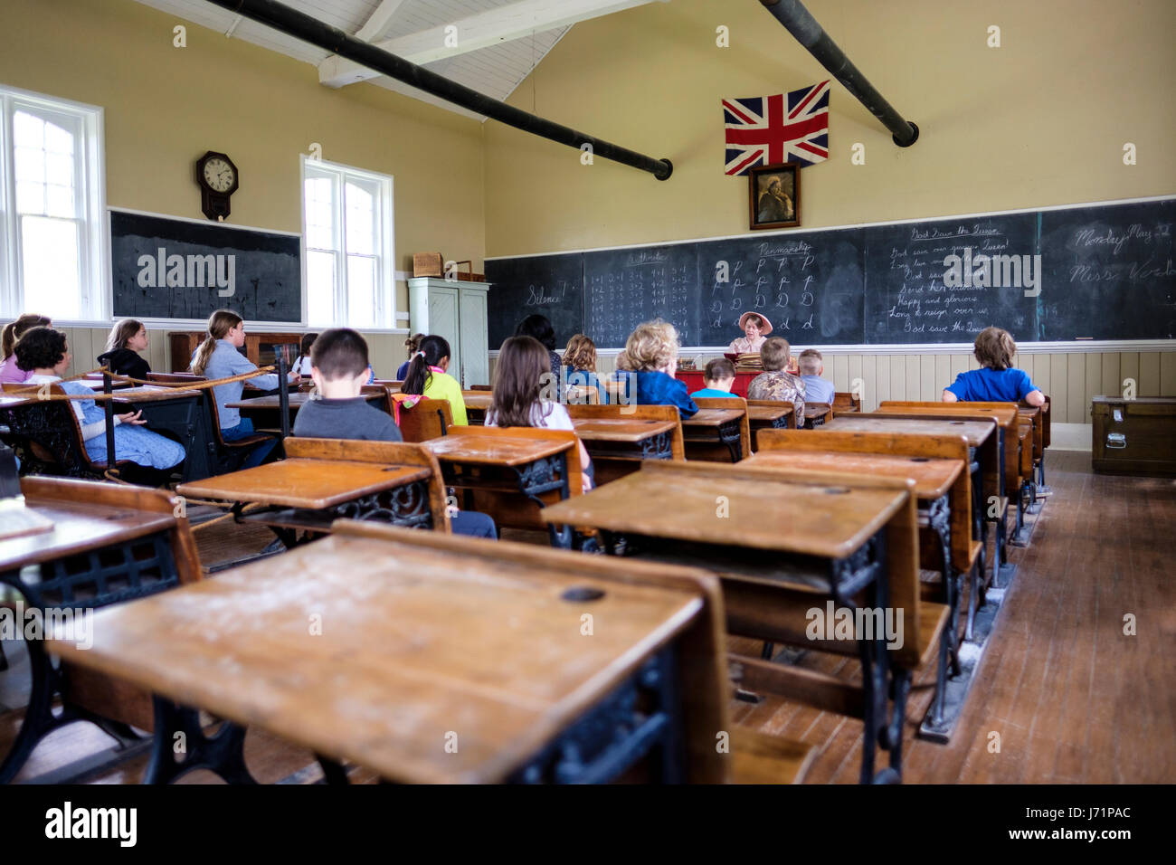 London, Ontario, Canada. 22th May, 2017. Victoria Day, a federal Canadian public holiday with celebrations in honour of Queen Victoria's birthday, also called Celebration of the Queen of England. Reenactment of a typical Victorian school day in a 1871 original school classroom at Fawshawe Pioneer Village, London, Ontario, Canada. Credit: Rubens Alarcon/Alamy Live News Stock Photo