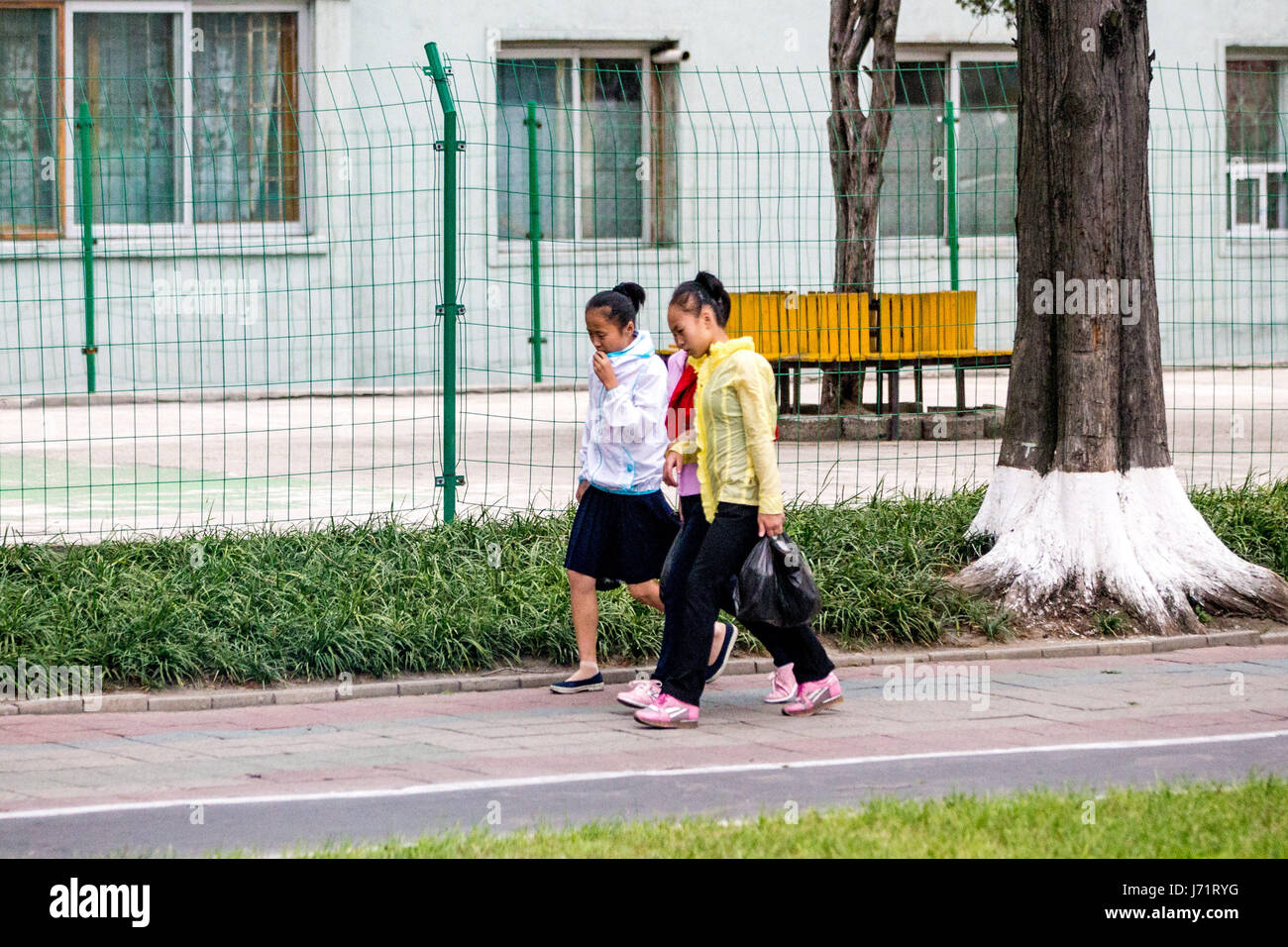 May 23, 2017 - Pyongyan, Pyongyan, China - Pyongyang, North Korea-August 2016: (EDITORIAL USE ONLY. CHINA OUT) Middle school students walking on street in Pyongyang. (Credit Image: © SIPA Asia via ZUMA Wire) Stock Photo