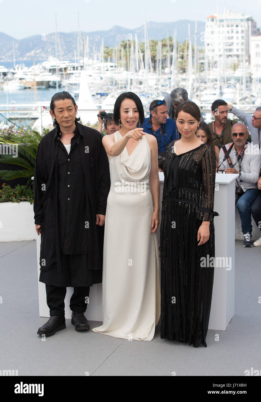 Cannes, France. 23rd May, 2017. Actor Masatoshi Nagase, actresses Misuzu Kanno and Atame Misaki (L-R) pose for a photocall of the film 'Hikari (Radiance) ' during the 70th Cannes Film Festival at Palais des Festivals in Cannes, France, on May 23, 2017. Credit: Xu Jinquan/Xinhua/Alamy Live News Stock Photo