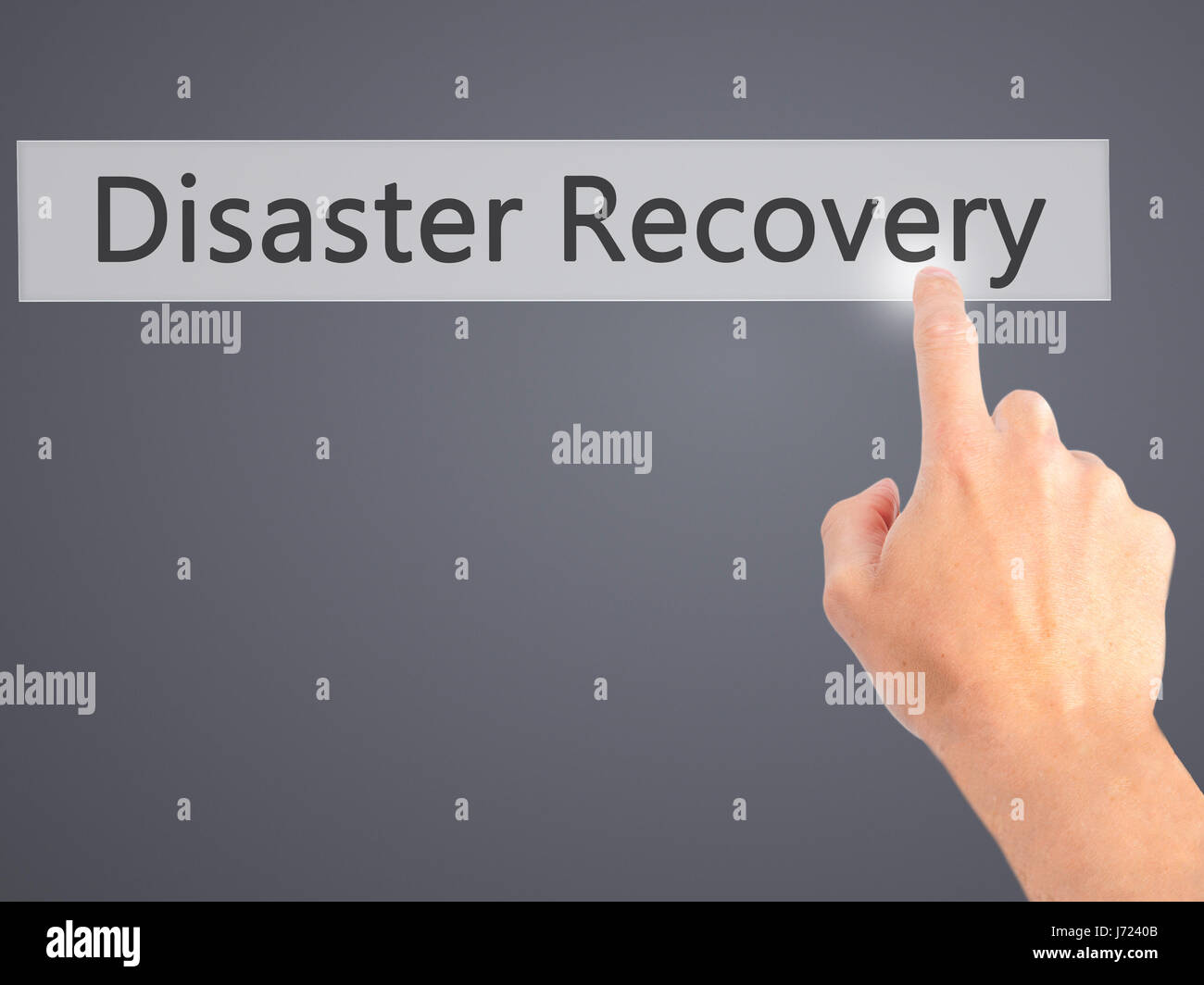 Disaster Recovery - Hand pressing a button on blurred background ...