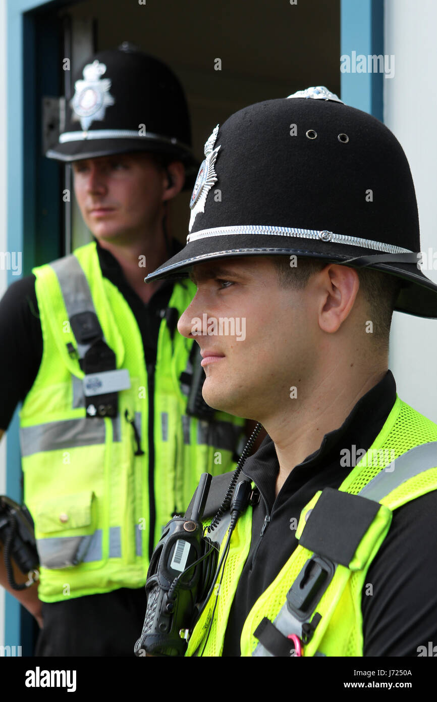 policeman british policemen police closeup uniform helmet patrol english Stock Photo