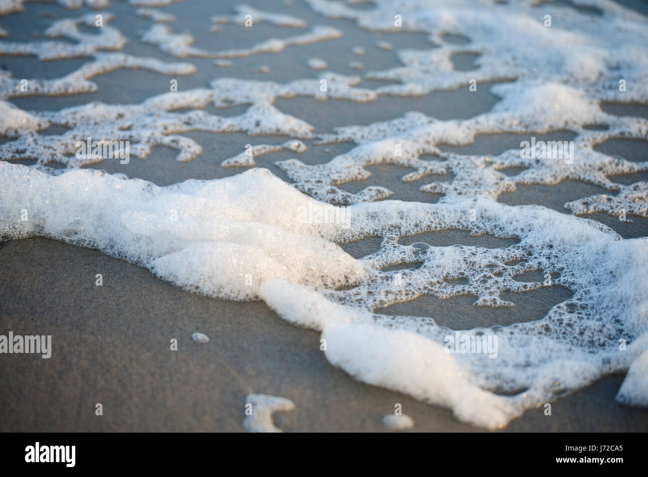 Beach Foam on Emerald Island North Carolina Stock Photo