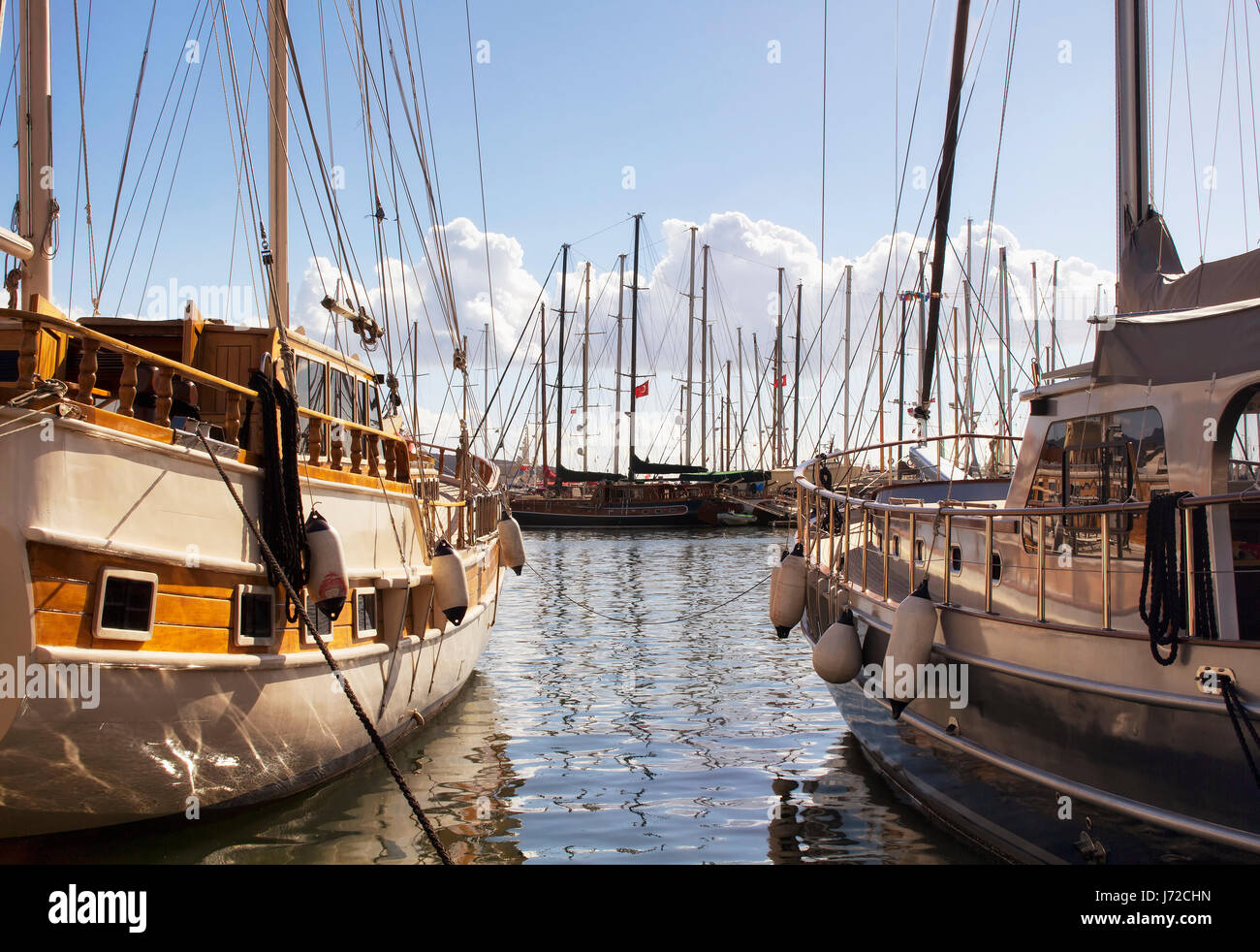 View of wooden yachts parked at Bodrum marina in a calm autumn day. Stock Photo