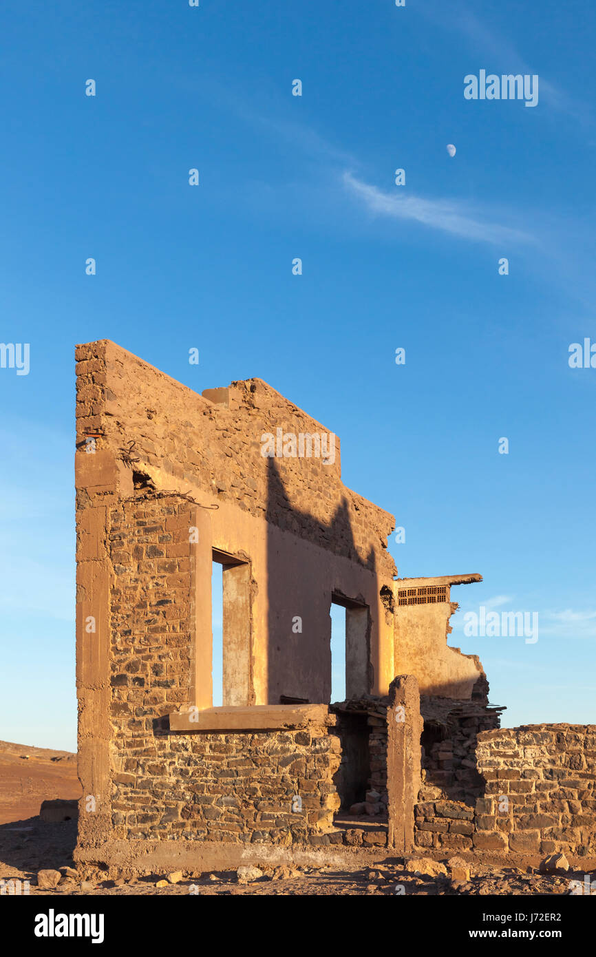 Building ruins and the moon, Mtis, Errachidia Province, Meknes-Tafilalet, Morocco Stock Photo