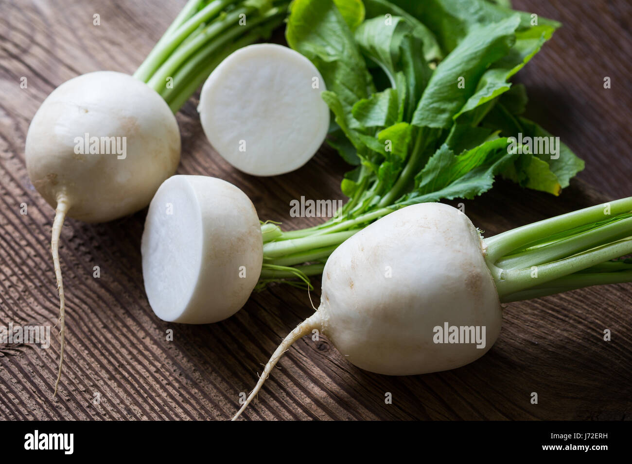 Tasty fresh crude white round japanese radish with green stems and leaves  Stock Photo - Alamy
