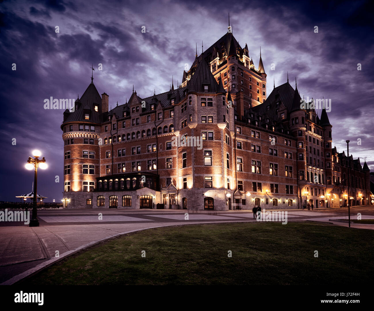 License available at MaximImages.com - Fairmont Le Chateau Frontenac with dramatic night sky lit by street lights, grand hotel. Old Quebec, Canada Stock Photo