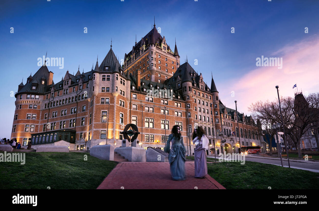 License available at MaximImages.com - Ghost tour guides in front of Fairmont Le Château Frontenac grand hotel Chateau Frontenac in Old Quebec City, Stock Photo