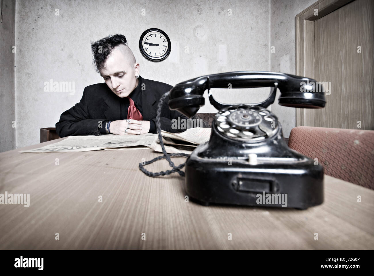 telephone phone newspaper journal daily paper scanning reads gothic man  office Stock Photo - Alamy