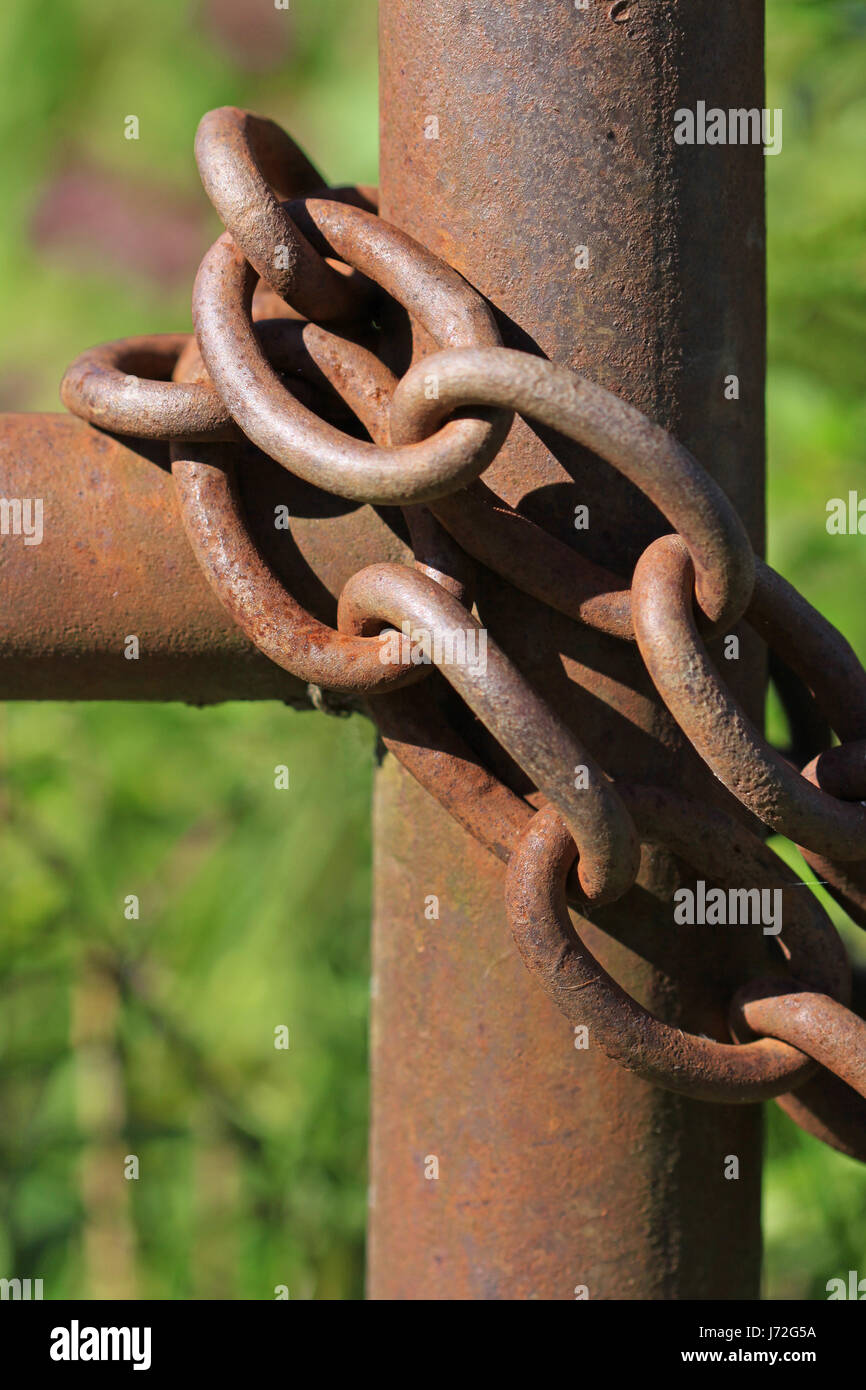 agriculture farming chain iron fence rust border barrier lock macro close-up Stock Photo