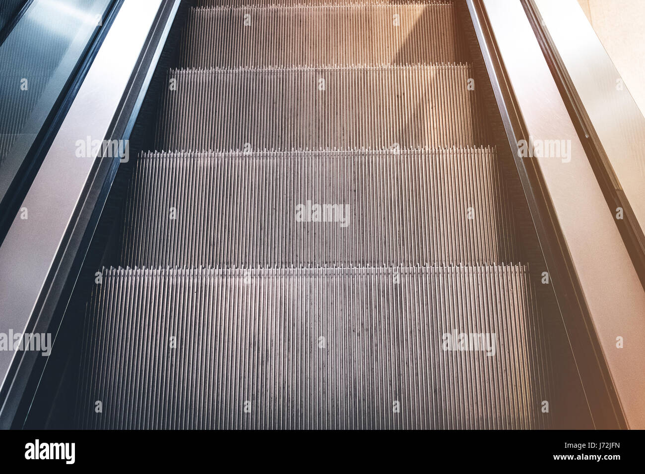 steps of escalator closeup looking down Stock Photo Alamy
