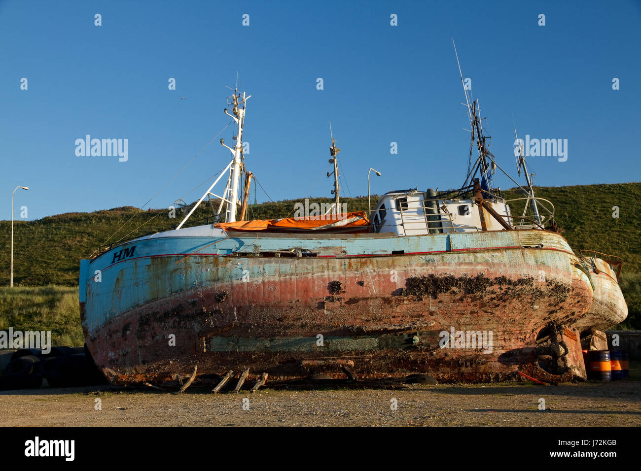 seafaring coast fishing boat wreck shipwreck salt water sea ocean water rowing Stock Photo