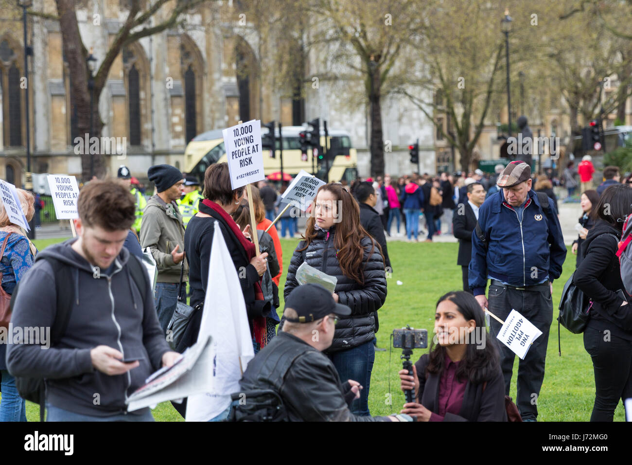 London, UK - 1st April, 2017. Young people gather outside Parliament to oppose the government’s scrapping of housing benefits for 18 to 21 year-olds Stock Photo