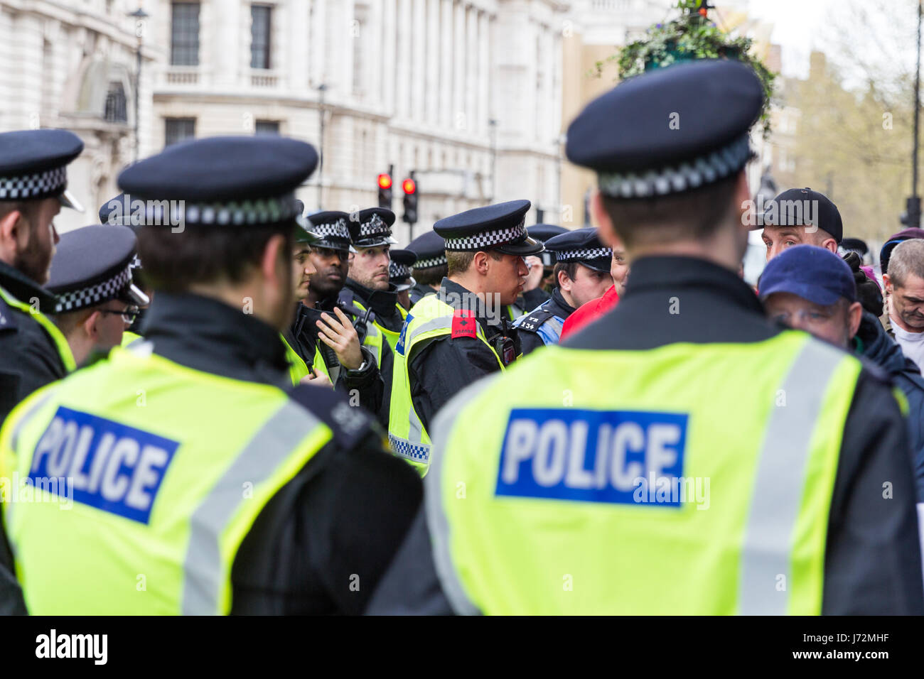 London, UK - 1st April, 2017. Police trying to keep in order protest against Islamists, ISIS. Stock Photo