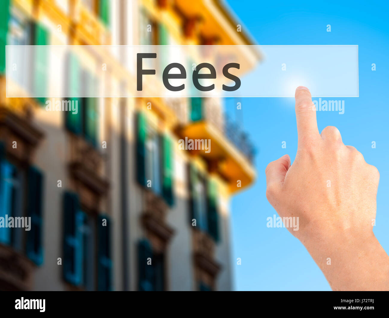 Fees - Hand pressing a button on blurred background concept . Business ...
