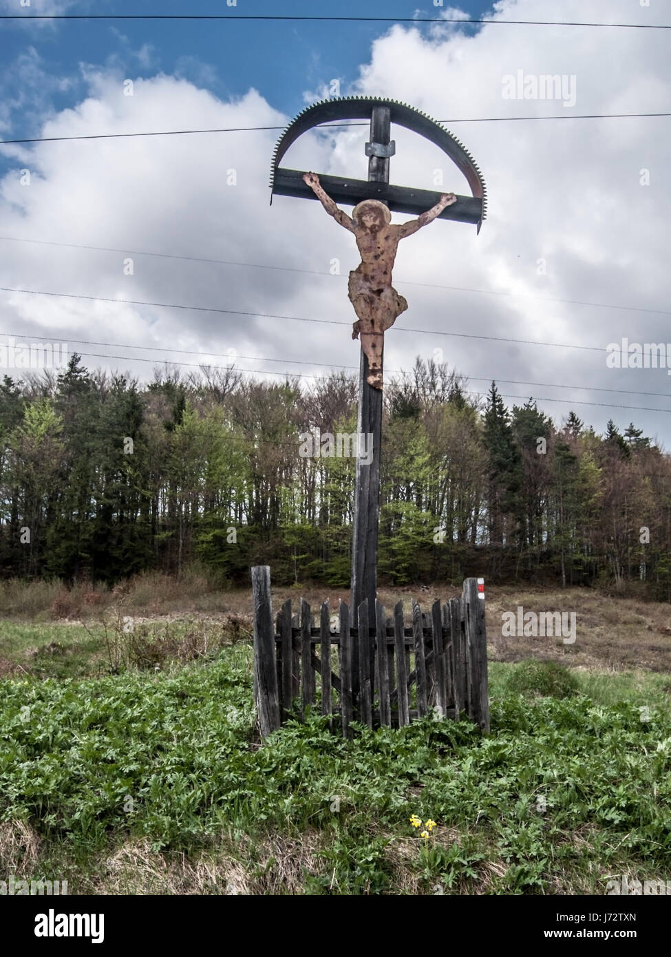 cross on mountain meadow with forest on the background on Lubochnianske sedlo in Velka Fatra mountains in Slovakia Stock Photo