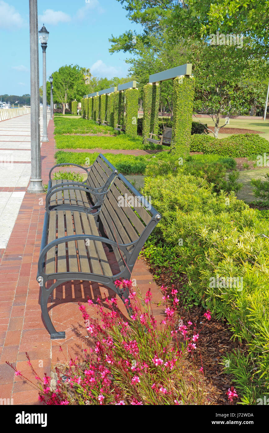 Benches and swings at the promenade of the Henry C. Chambers Waterfront Park located south of Bay Street in the Historic District of downtown Beaufort Stock Photo