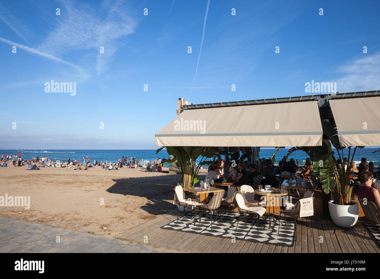 Beach and outdoor cafe restaurant in Barceloneta, Barcelona, Spain Stock Photo