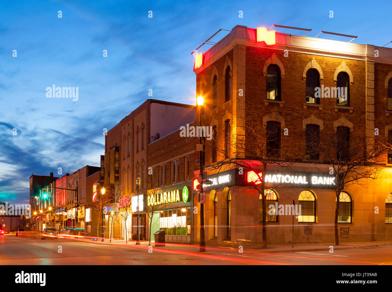 Downtown Barrie in the spring along Dunlop Street East at dusk. Barrie Ontario, Canada. Stock Photo