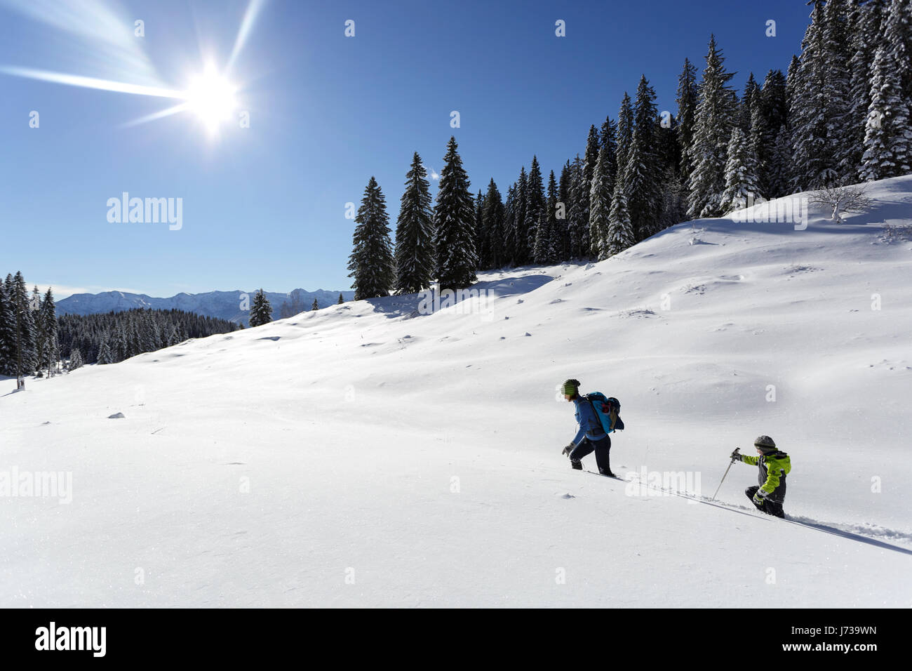 Mother and Son Hiking in Snow, Slovenia. Stock Photo