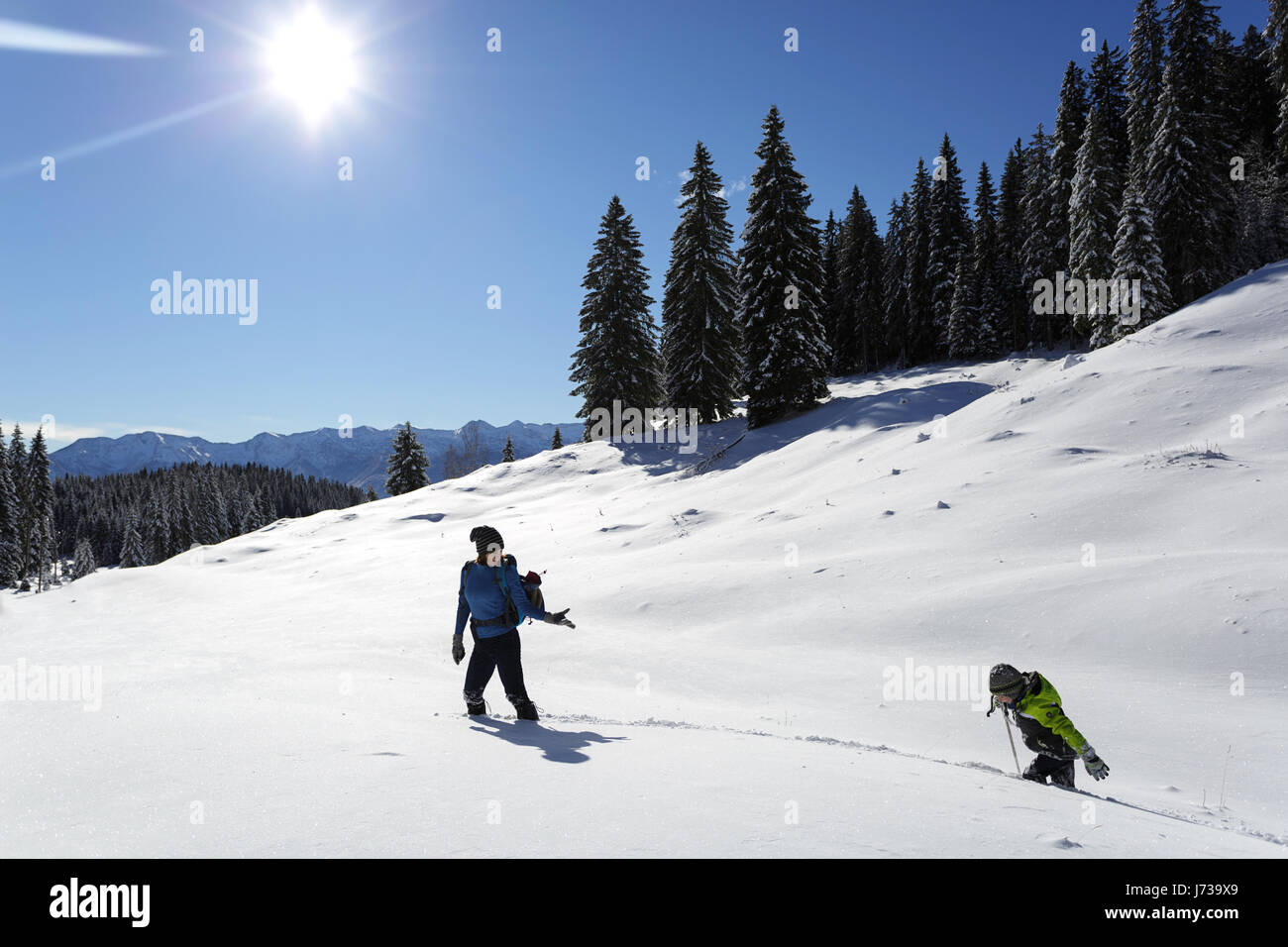 Mother and Son Hiking in Snow, Slovenia. Stock Photo