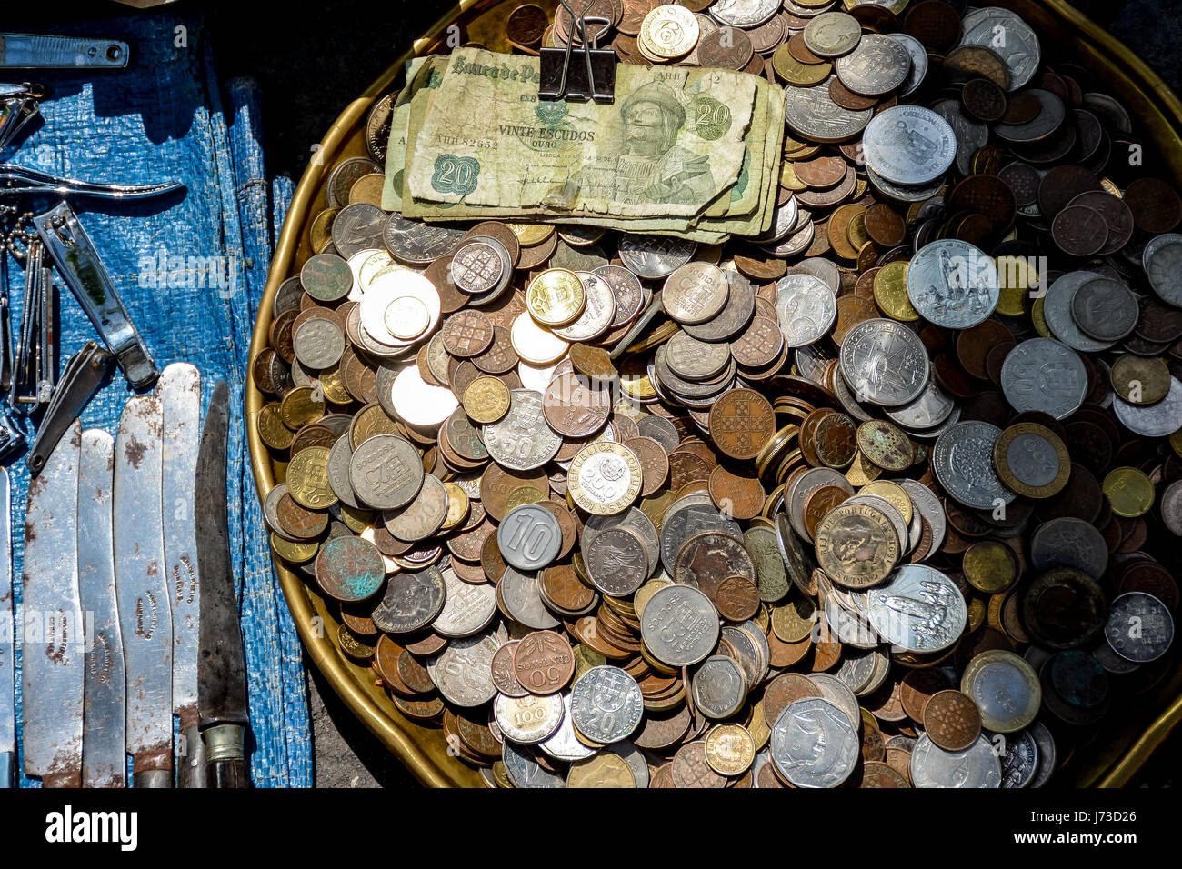 Lots of cash money in coins Stock Photo