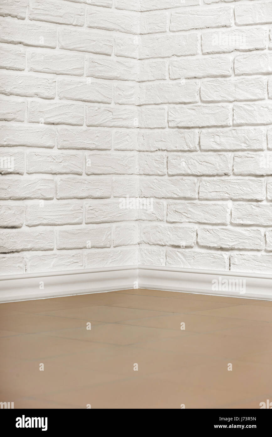 white brick wall with tiled floor and corner, abstract background photo ...
