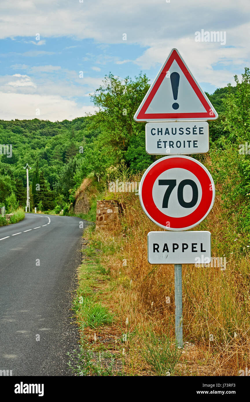French road traffic signs on a quiet rural road Stock Photo