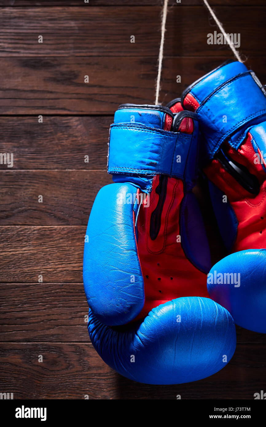 Blue And Red Boxing Gloves Hanging On Wooden Wall Stock Photo Alamy