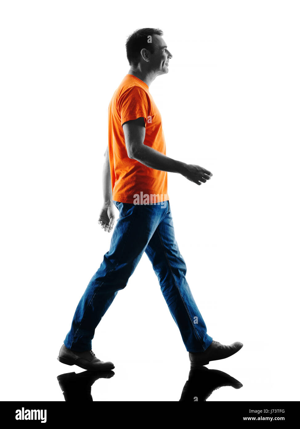 one causcasian man Walking in silhouette isolated on white background Stock Photo